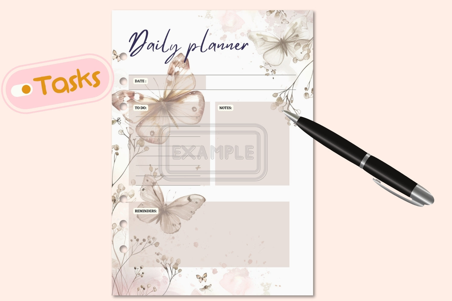 Close-up of beige daily planner with watercolor butterfly design, printable PDF.